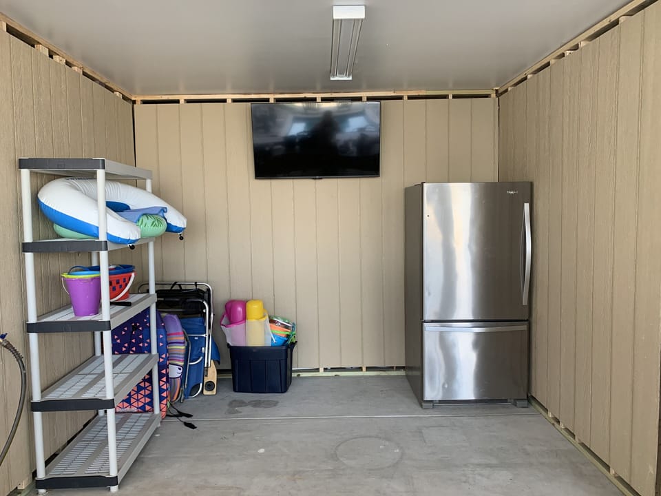 50” fire tv with Hulu, fridge, beach chairs and beach/pool toys. 