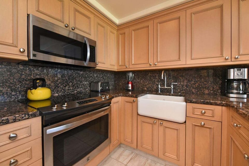 Cook with ease in a kitchen framed by granite and wood.