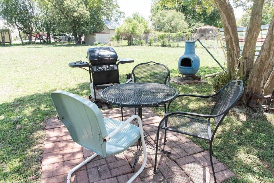 Crepe Myrtle shade outdoor seating and gas grill area