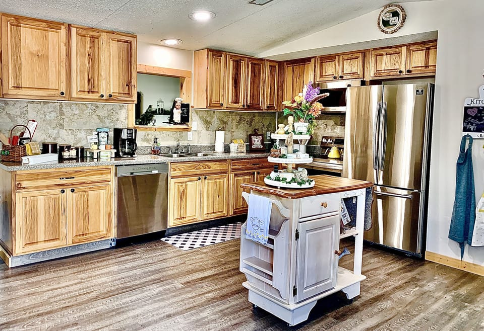 Kitchen is open to dining area with an island so the whole family can participate in making meals