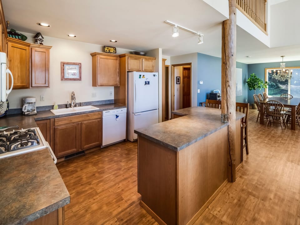 Full kitchen with open concept to living room and dining room
