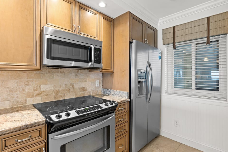 Enjoy cooking with Gulf views from your fully equipped kitchen.

Professionally Managed by
Breathe Easy Rentals