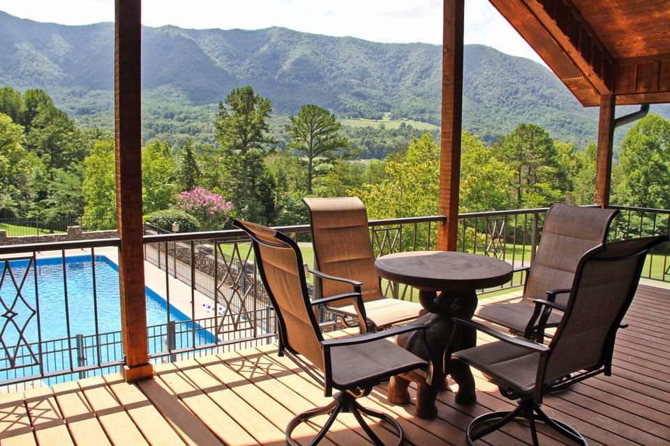 Covered balcony overlooking the private seasonal pool and the Smoky Mountains.
