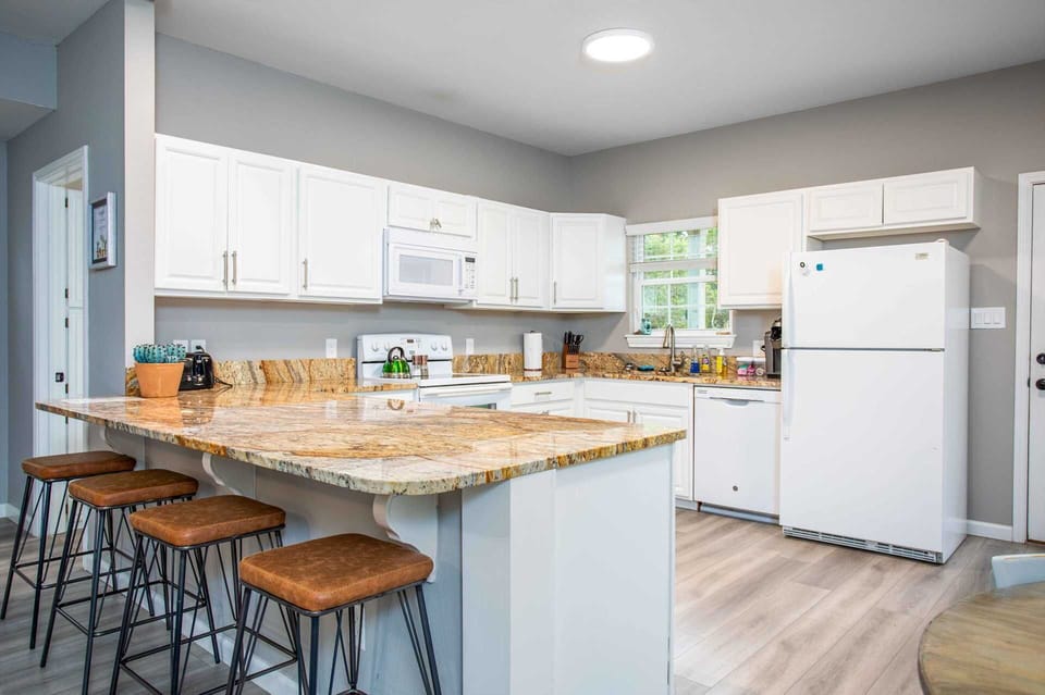 Bar seating, tons of counter space, and modern appliances make the Retreat's kitchen absolutely exceptional!