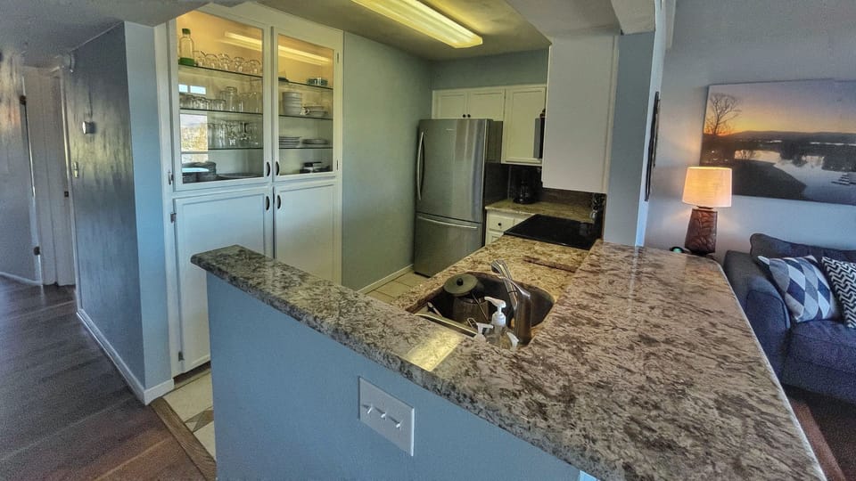 Kitchen with granite countertops and stainless steel appliances