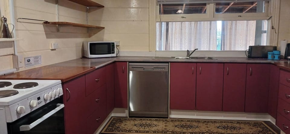 Roomy kitchen with fridge-freezer, stove, dishwasher & microwave