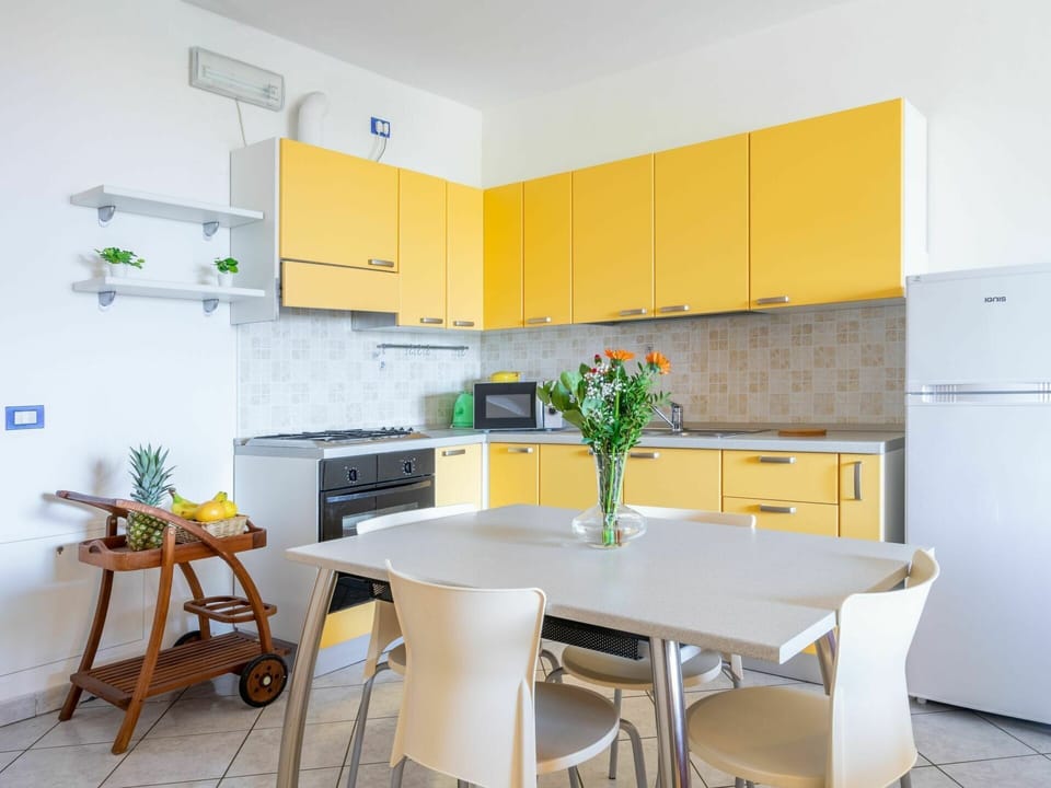 Cabinetry, Furniture, Property, Countertop, Table, Orange, Kitchen Stove, Interior Design, Wood, Kitchen