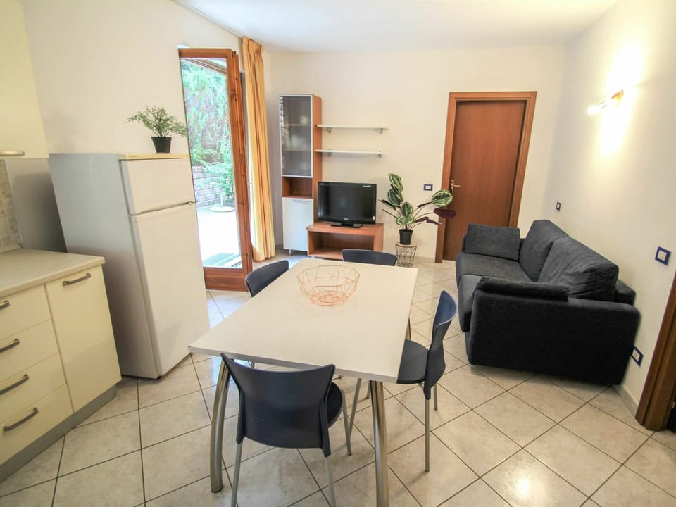 Furniture, Cabinetry, Houseplant, Building, Table, Comfort, Television, Architecture, Wood, Flooring
