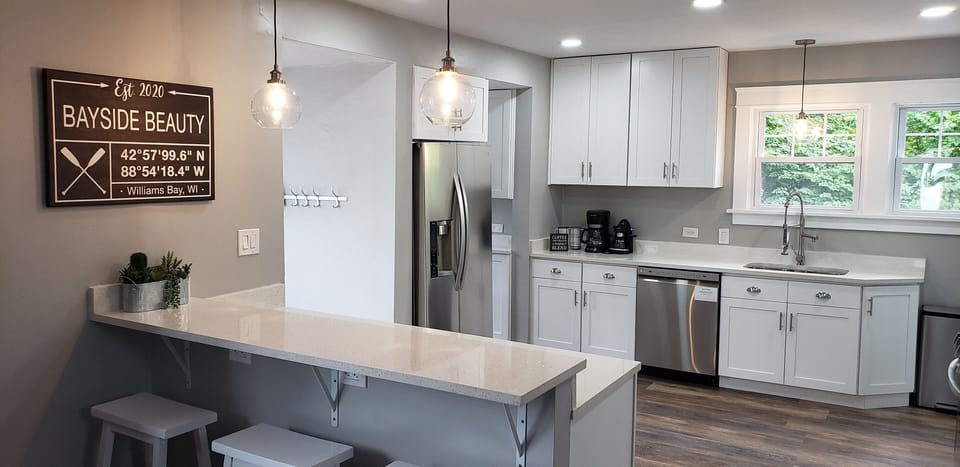 New kitchen with 3 seats at the peninsula.
