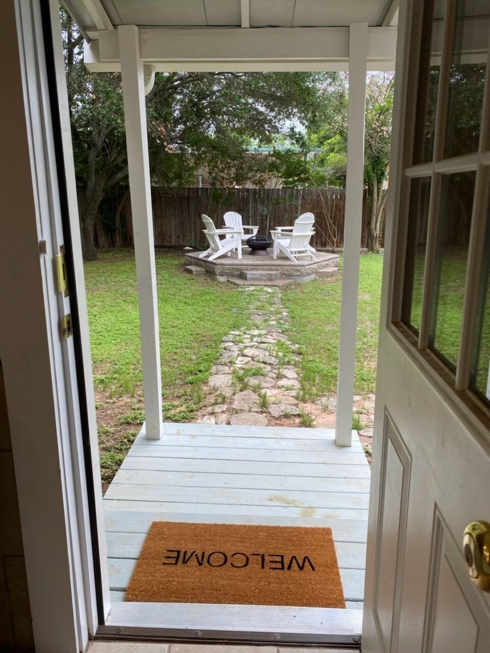 The backdoor comes out of the kitchen. It's equipped with keyless entry.