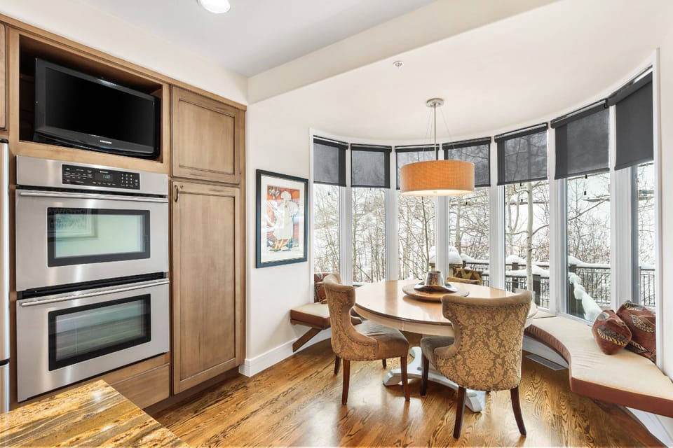 This cozy kitchen banquette is perfect for any meal with this stunning view