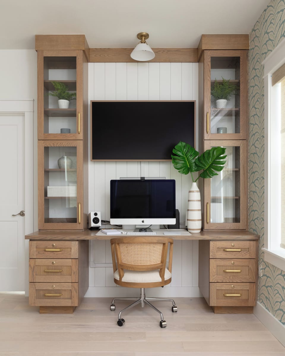 Bright workspace with dual monitors and stylish storage for productivity!