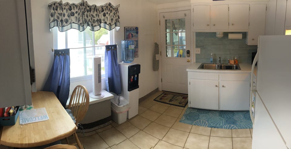 Kitchen, view of back door entrance from parking lot 