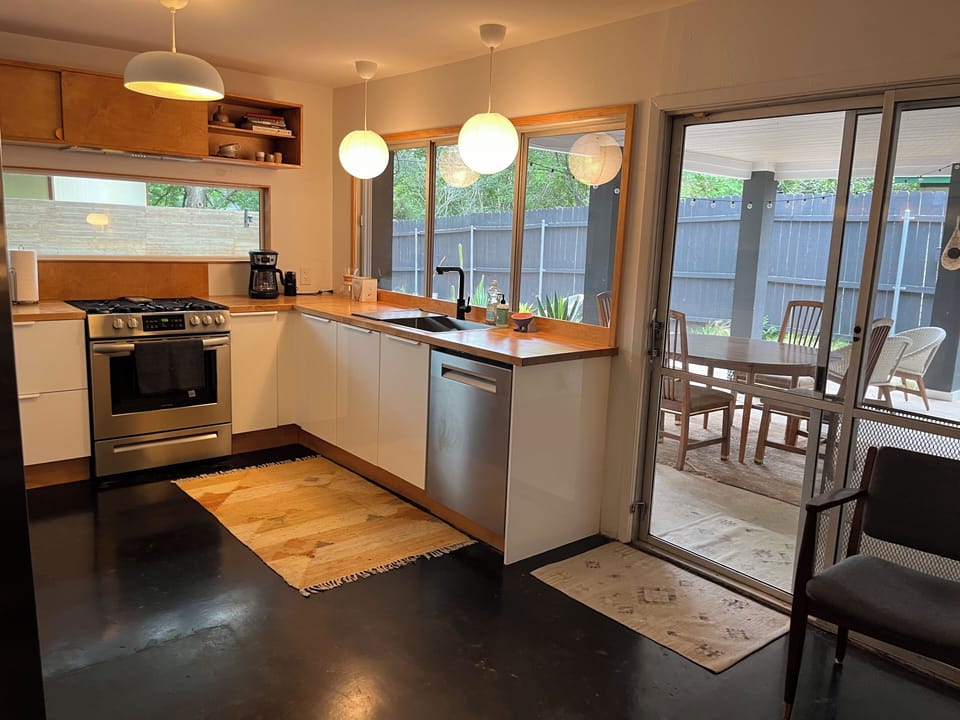 Sliding door in kitchen leading to covered patio