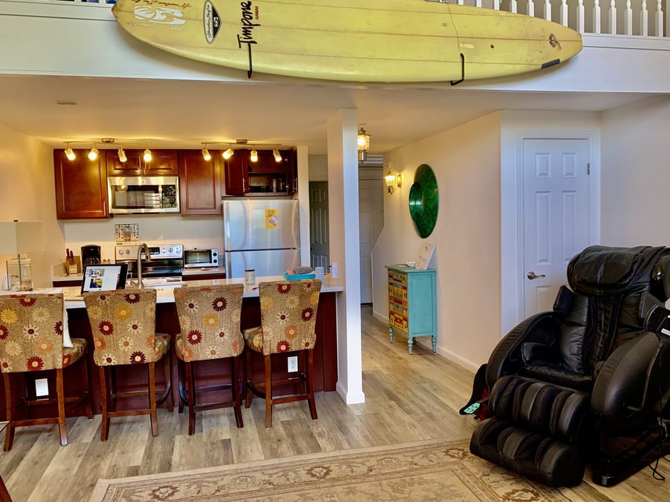 Bar area for your meals.  Awe and a massage chair to relax your muscles. 