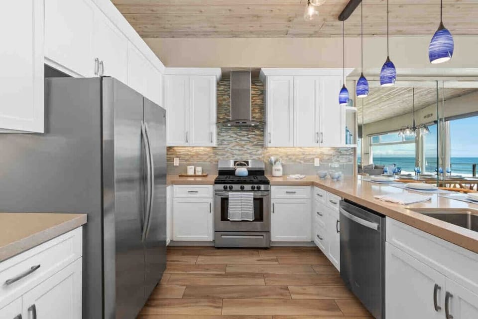 Oceanfront rental in Oceanside California, Beachfront vacation rental, Oceanside beach house, Direct beach access nearby, Private sandy backyard, Fire pit on the beach, No street between house and ocean, Walk to Oceanside Pier, Walk to restaurants and cof