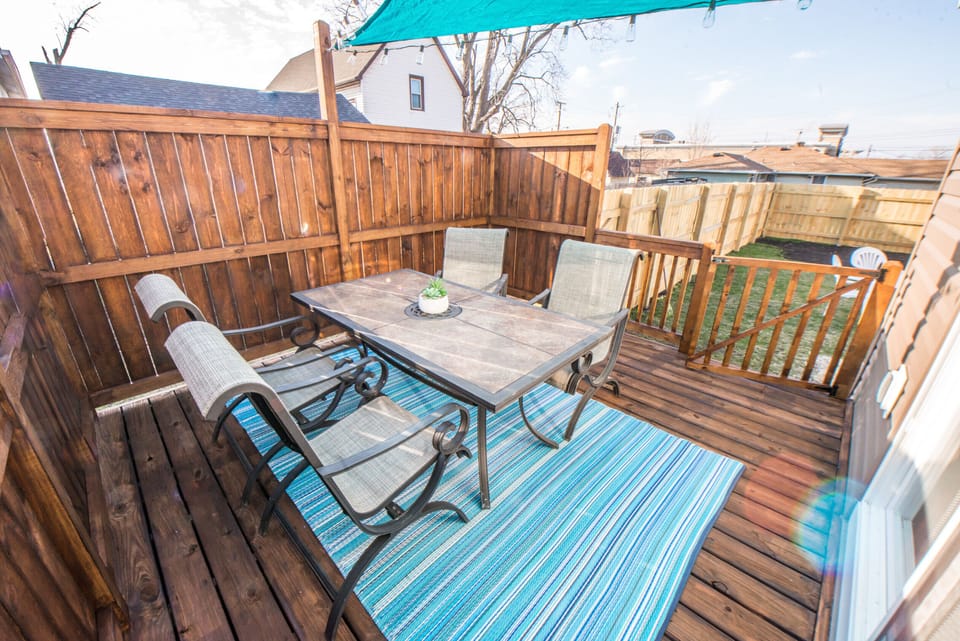 Deck off Fam Rm Sliding doors, grill, fire pit, Italian lights; sun sail.