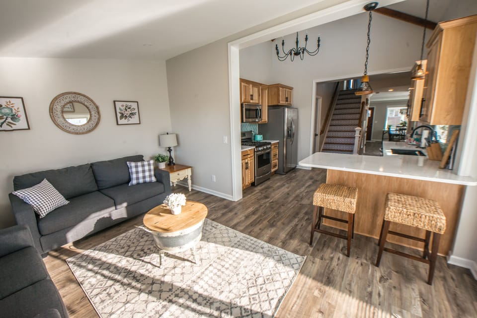Beautiful family room and kitchen island with stools
