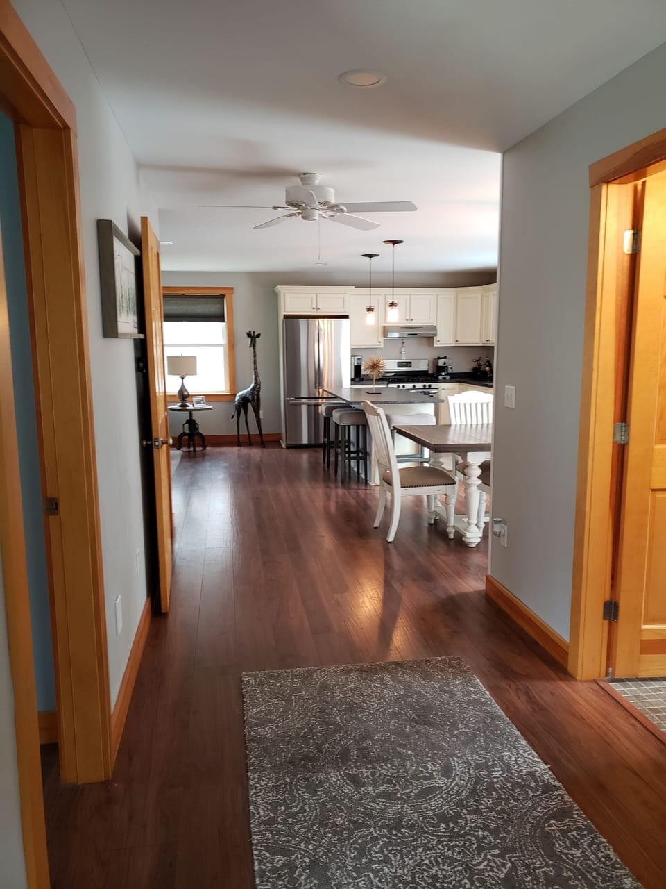 view from the mud room to the kitchen dining living area