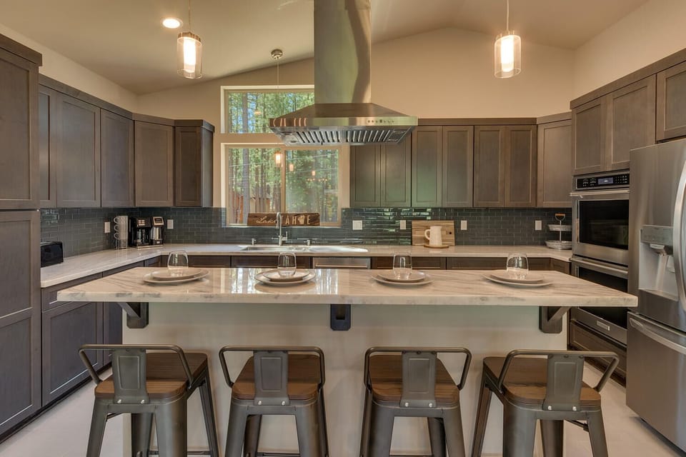 - Gourmet kitchen with marble countertops  
- Modern cabinets and stainless fridge  
- Cabin rental with chef style kitchen