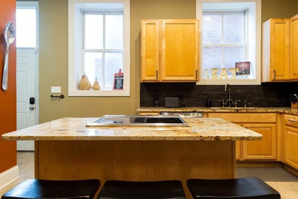 A fully equipped kitchen with plenty of counter space and seating for your group. #FullKitchen