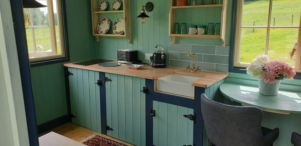 There is a handy little built in dining table next to the kitchen area. 