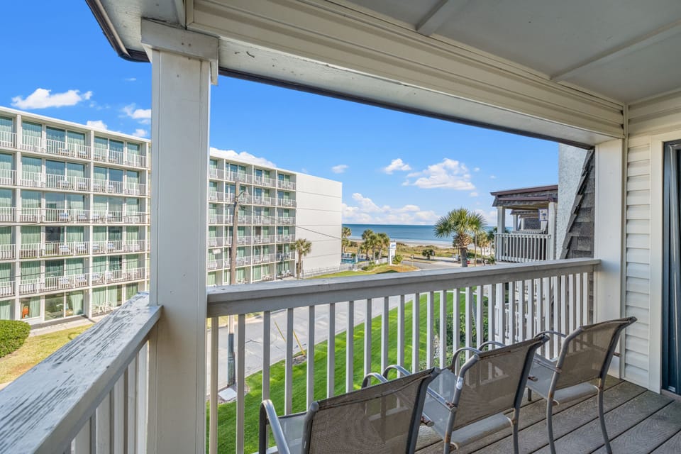Sit outside and relax on this ocean view balcony and listen to the waves.