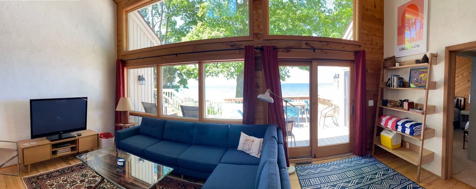 Living room with floor to ceiling windows looking over Lake Michigan. 