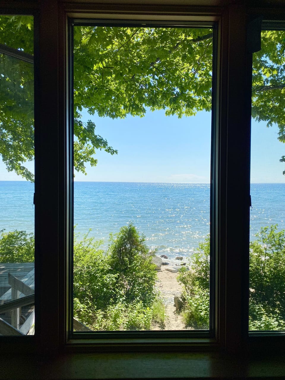 View of Lake Michigan from bedroom #1; sand path to beach that's steps away. 