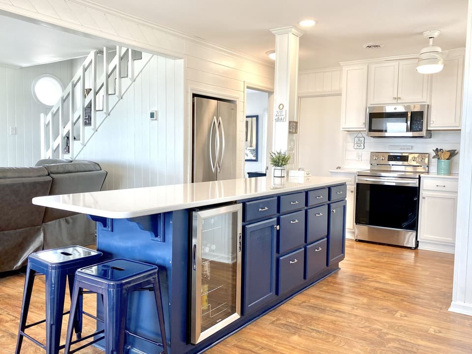 Large quartz island with beverage fridge