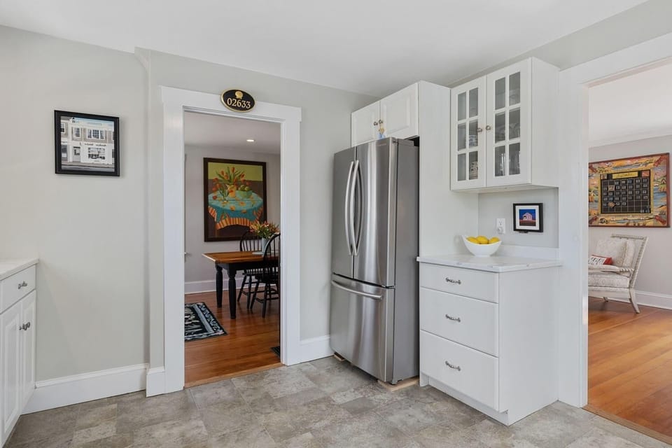 Refrigerator with Doors to Dining Area and Living Room