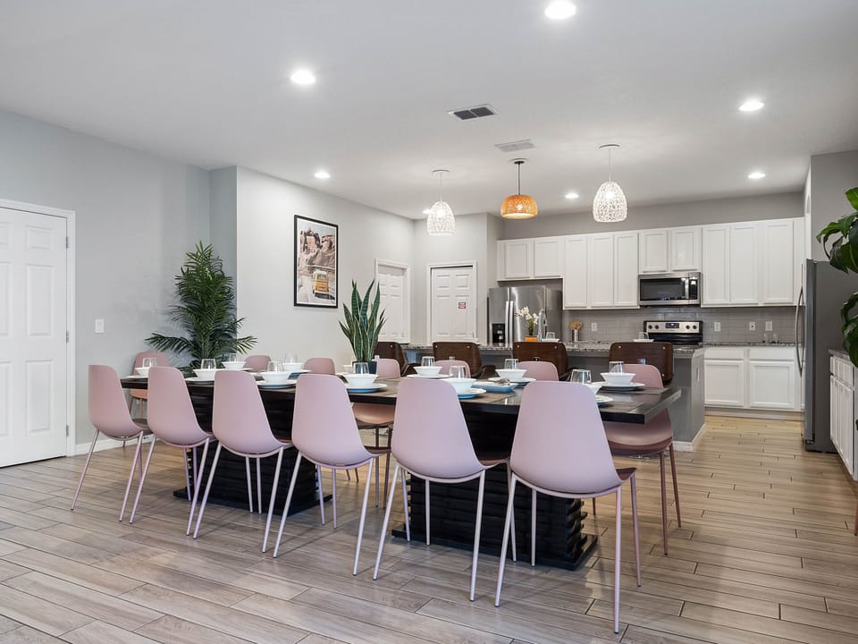 - Spacious dining area with seating for large groups  
- Modern open kitchen with stainless steel appliances  
- Orlando vacation rental perfect for family gatherings