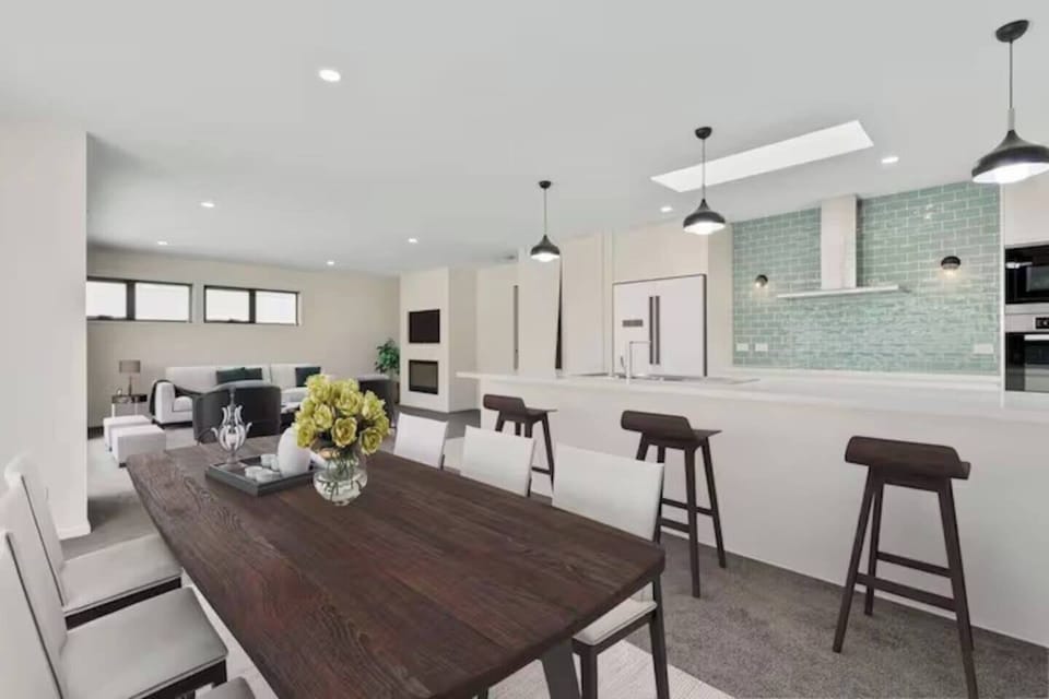 Enjoy a streamlined floor plan that makes gathering easy. Dine together at the long dining table or have casual meals at the breakfast bar.