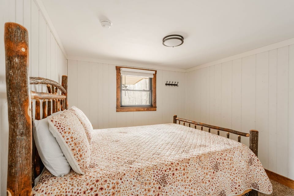 Second main floor bedroom with queen bed