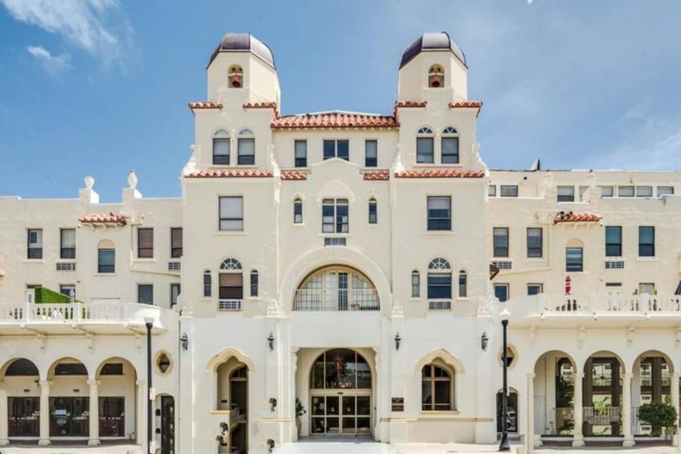 The Palm Beach Hotel is a true Historic Landmark showcasing stunning double bell tower Spanish Baroque architecture that exudes old-world glamour and the charm of a bygone era. Fun fact: Publix is conveniently located just across the street.