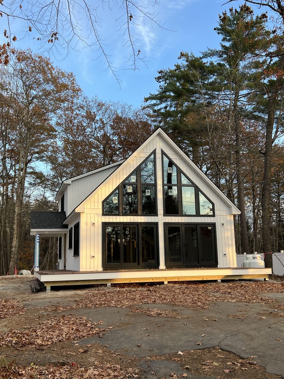 House Front w/ large deck facing the water. Deck furniture when complete.