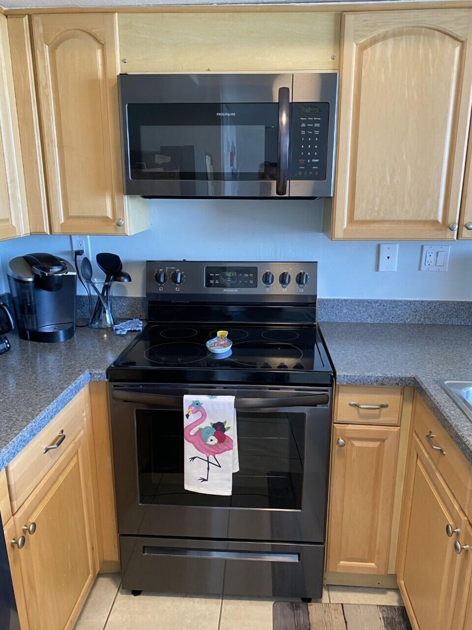 Fully stocked kitchen.  Black Stainless appliances.