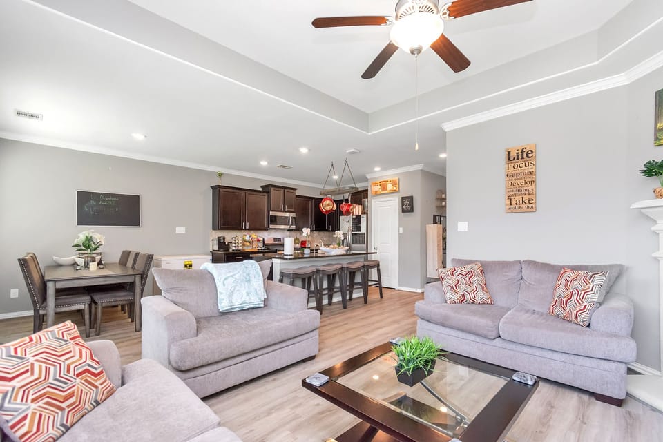 Living room with gas fireplace and smart TV.
