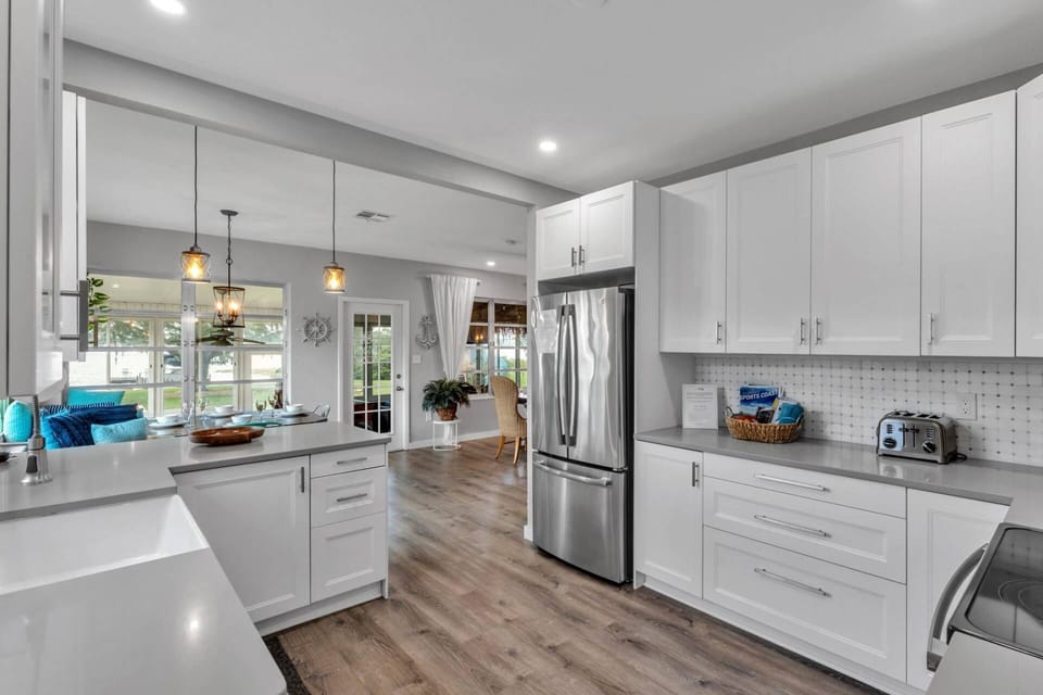 Spacious modern kitchen with stainless appliances and generous counter space.