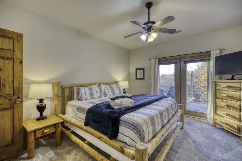 King bedroom on lower level, opens to patio with hot tub and fire pit!