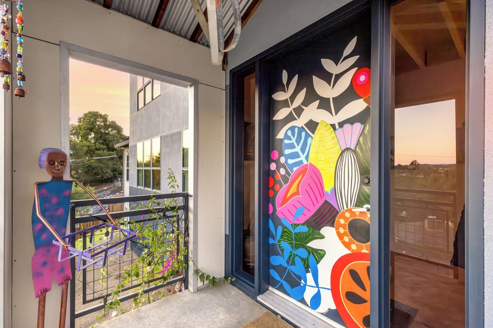 Playful front door painted by Jen a very talented muralist.  
