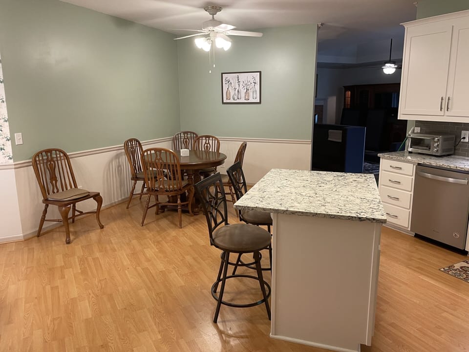 Table has two leafs to easily sit 6 along with two bar stools at the island.  