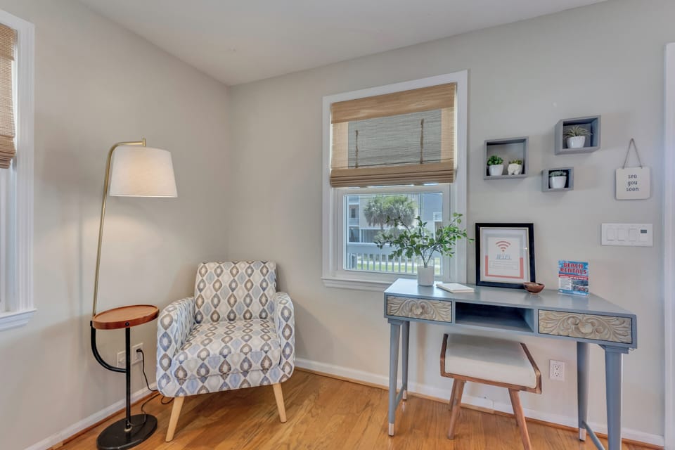 Cozy space for reading and desk for working or writing.
