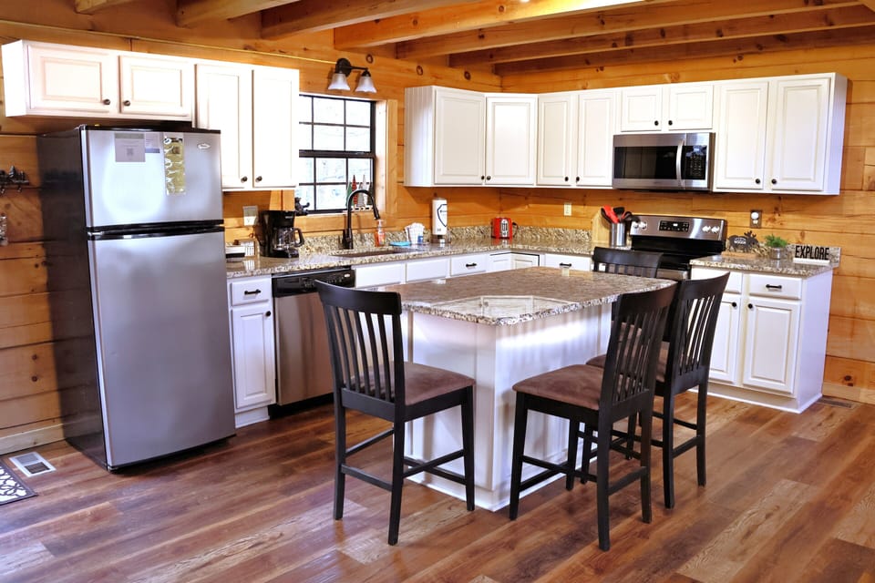 Fully stocked kitchen with newer appliances.