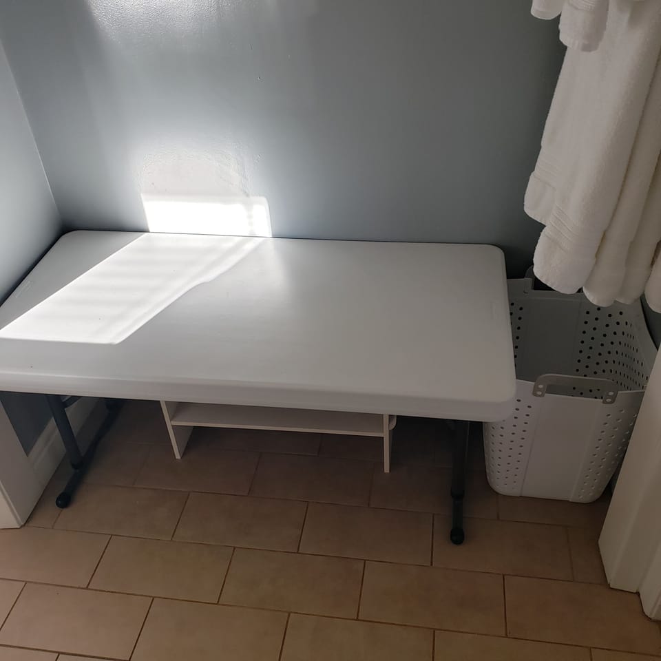 Luggage table with storage below. 