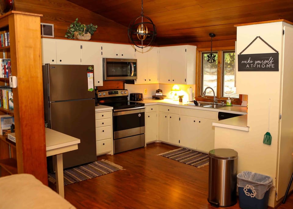 Full kitchen with plenty amenities to make cooking for you during your stay.