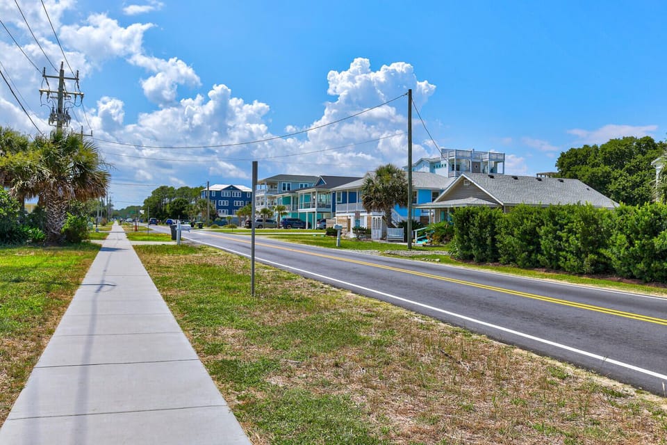 Wide sidewalk for your short stroll from the beach.