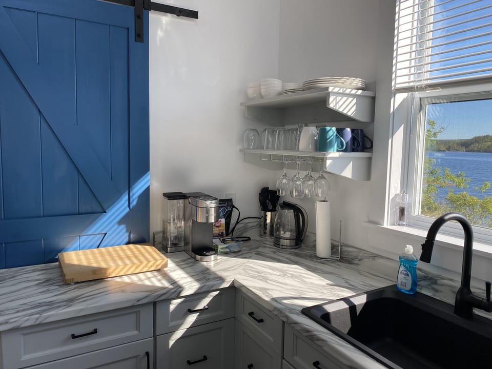 Fully stocked kitchen with coffee / tea station
