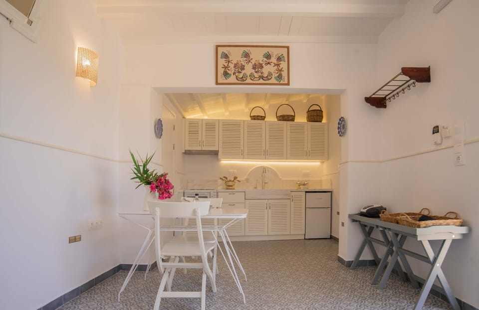 The painting is hand made by Mrs. Zoi, an old cretan woman.