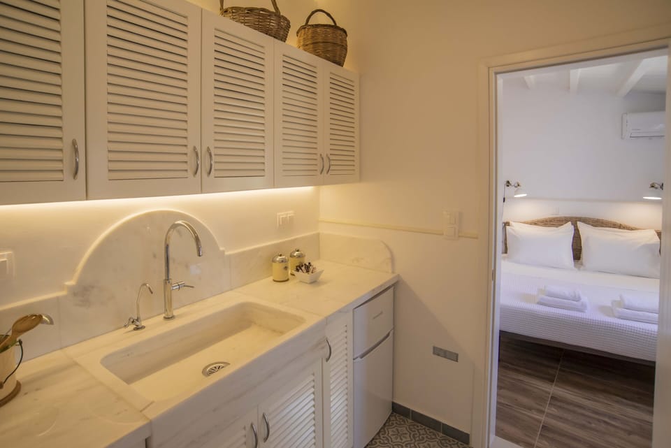 The bedroom is next to the kitchen